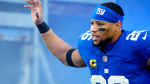 New York Giants running back Saquon Barkley (26) takes the field at MetLife Stadium, Sunday, January 7, 2024.